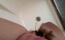 stacked-brunette-teen-fingers-her-hairy-cunt-in-the-shower