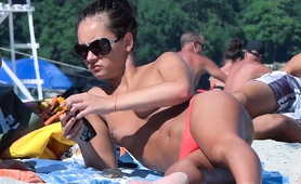 nude-beach-girl-filmed-enjoying-a-sunny-day-at-the-beach