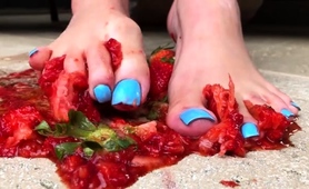 dominatrix-crushing-and-squeezing-strawberries-with-her-feet